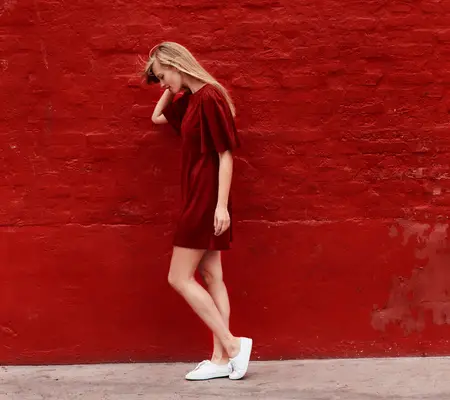 White sneakers with a red dress